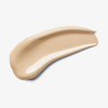 Ein sanfter, beiger Klecks Skin Realist Tinted Balm auf weißem Hintergrund.