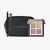 LH Cosmetics x PURISH Birthday Special: schwarze LH Tasche, Shimmer Saga Lidschattenpalette, Pinsel und brauner Eyeliner-Stift nebeneinander.