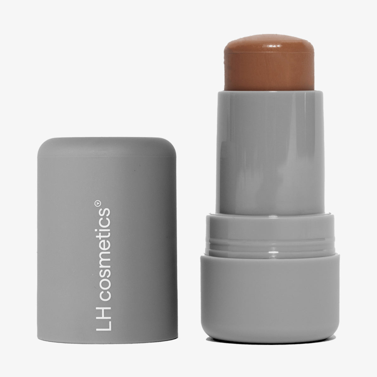 Ein geöffneter grauer Drehstift mit herausgedrehtem mittelbraunen Artistick Bronzer Buff vor weißem Hintergrund