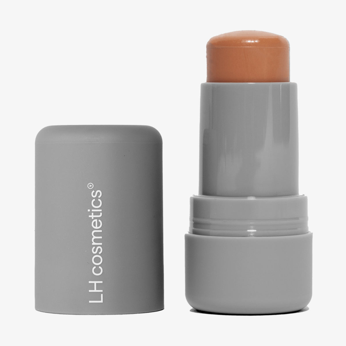Ein geöffneter grauer Drehstift mit herausgedrehtem dunkelbeigem Artistick Bronzer Tint vor weißem Hintergrund