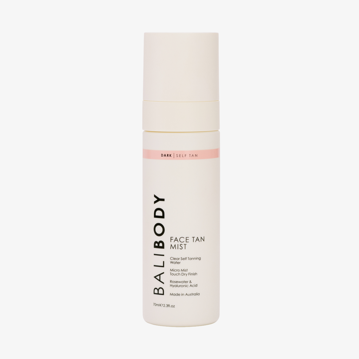 Eine Flasche „Bali Body Face Tan Mist“ mit einem weiß-rosa Etikett, abgebildet vor einem schlichten weißen Hintergrund.