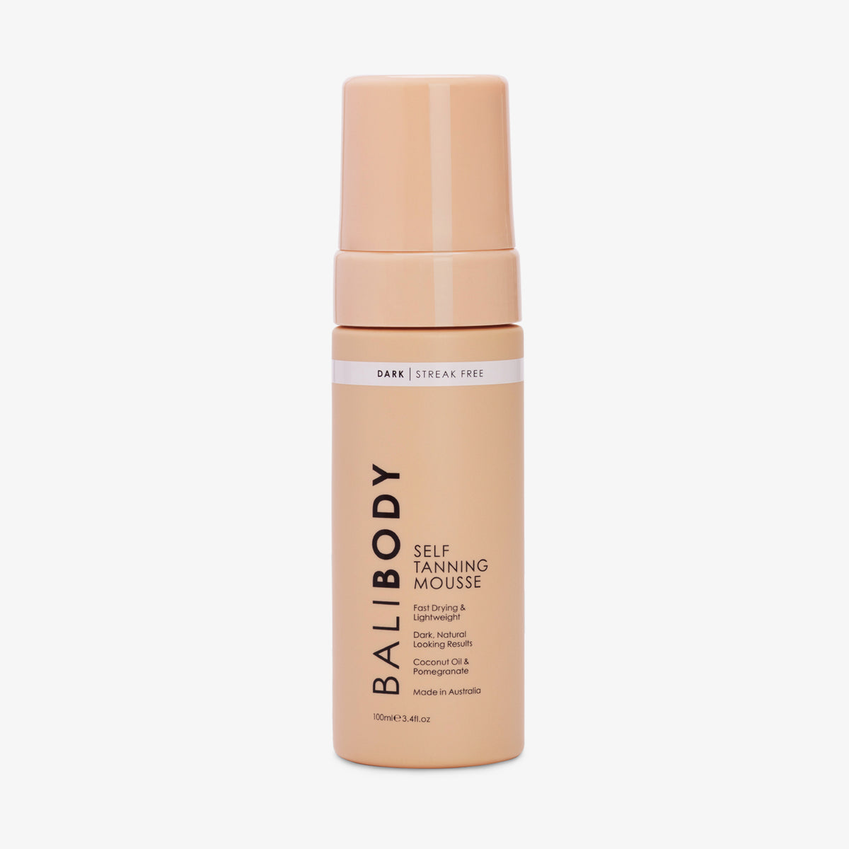 Eine pfirsichfarbene Flasche Self Tanning Mousse 100 ml Dark vor weißem Hintergrund.