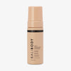 Eine pfirsichfarbene Flasche Self Tanning Mousse 100 ml Ultra Dark vor weißem Hintergrund.