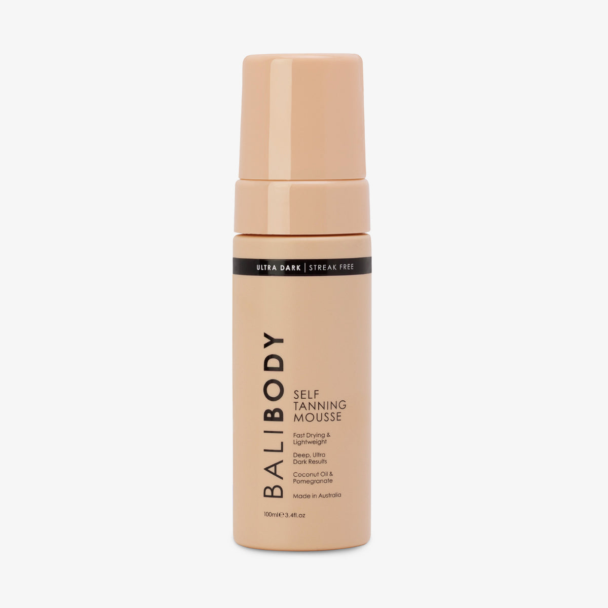 Eine pfirsichfarbene Flasche Self Tanning Mousse 100 ml Ultra Dark vor weißem Hintergrund.