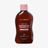 Organisch geformte braune Flasche Watermelon Sunscreen Oil SPF50 mit rosa Details und Deckel auf weißem Hintergrund.