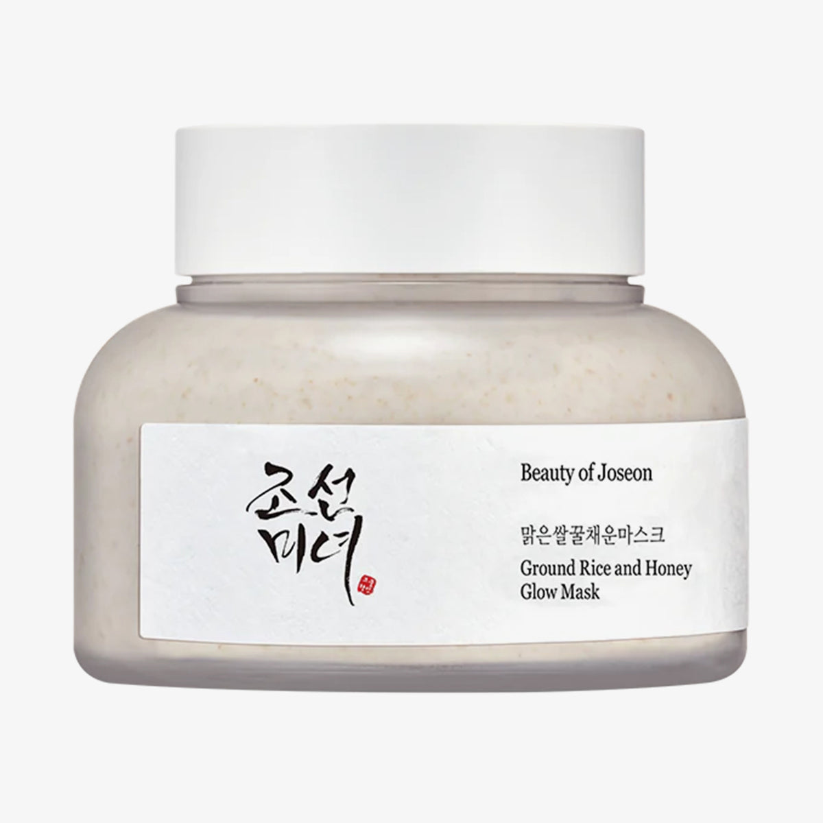 Mattierter transparenter Tiegel Ground Rice and Honey Glow Mask mit weißem Deckel vor weißem Hintergrund.