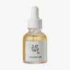 Transparente Tropfflasche Glow Serum: Propolis+Niacinamid mit weißem Deckel  und gelblich-brauner Flüssigkeit vor weißem Hintergrund
