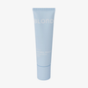 Eine blaue Tube mit der Aufschrift „BLONDESISTER 2 IN 1 NATURAL BEAUTY TINTED CREAM SPF15“ auf weißem Hintergrund.