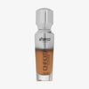 Eine halb transparente halb silberne Flasche Chroma Cover Foundation Luminous in der Farbe N8 vor weißem Hintergrund. 