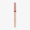 Schlanke Tube des Catrice Colour Cushion Juicy Lip Oils in Rosé-Gold und Nude, elegant und minimalistisch vor weißem Hintergrund.