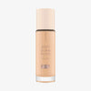 Eine Glasflasche Soft Glam Filter Fluid 015 von Catrice mit hellrosa Deckel und roséfarbener Schrift vor weißem Hintergrund.
