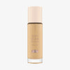 Eine Glasflasche Soft Glam Filter Fluid 020 von Catrice mit hellrosa Deckel und roséfarbener Schrift vor weißem Hintergrund.