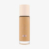 Eine Glasflasche Soft Glam Filter Fluid 040 von Catrice mit hellrosa Deckel und roséfarbener Schrift vor weißem Hintergrund.