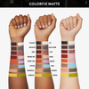 Drei Arme mit unterschiedlichen Hauttönen zeigen Swatches der verschiedenen matten Farbtöne von Danessa Myricks Beauty Colorfix Pastels, die jeweils mit ihrem Namen beschriftet sind.