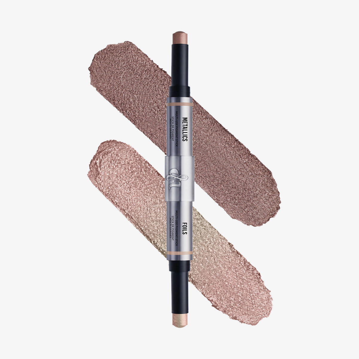 Zweifarbiger Pigment-Stick von Danessa Myricks mit zwei schimmernden Nuancen: ein mittleres Taupe-Braun und ein zartes Rosé-Champagner, nebeneinander aufgetragen.