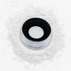 Danessa Myricks Beauty Evolution Powder Dose mit losem weißen Puder auf weißem Hintergrund.