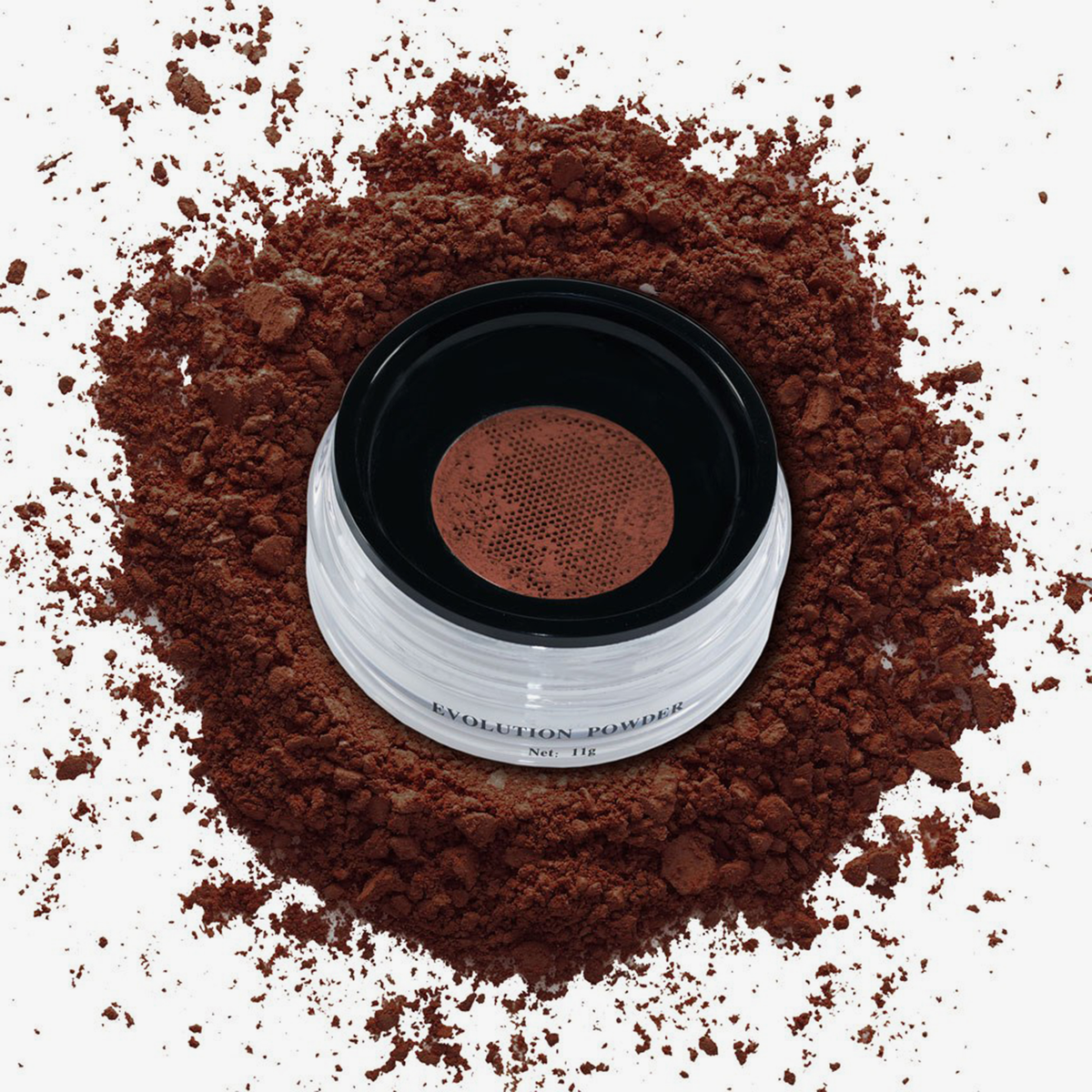 Danessa Myricks Beauty Evolution Powder verteilt sich in einem durchsichtigen Behälter mit schwarzem Deckel, von oben gesehen.
