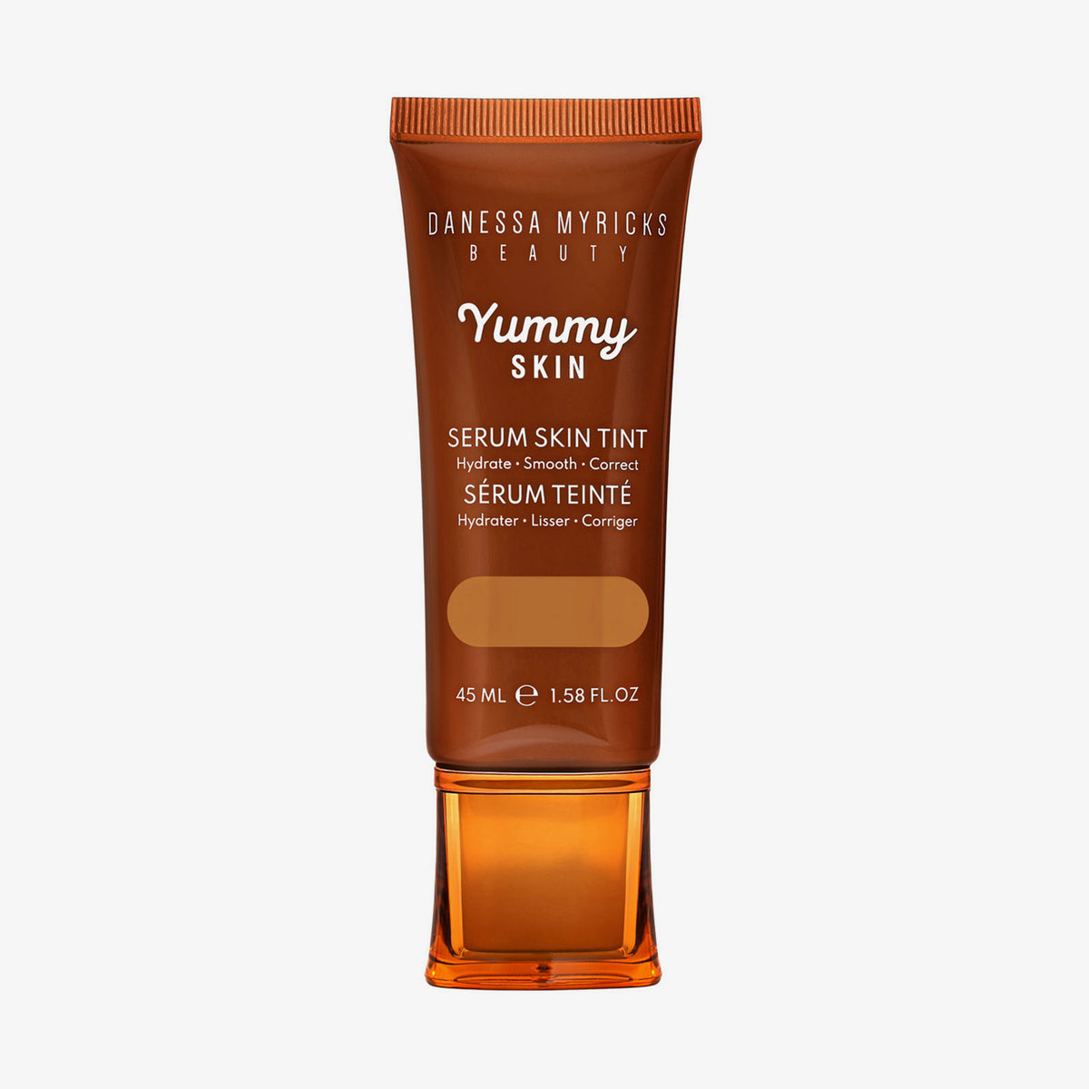 Bronzefarbene Tube der Yummy Skin Serum TInt 10 mit Sichtfenster zum warmem braunen Produktinhalt.