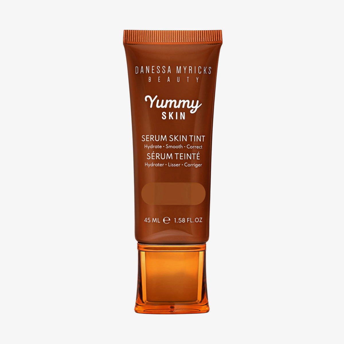 Bronzefarbene Tube der Yummy Skin Serum Tint 12 mit Sichtfenster zum dunkelbraunem Produktinhalt.