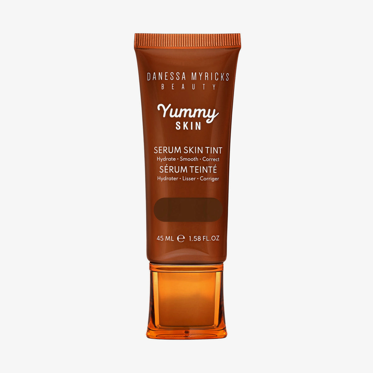 Bronzefarbene Tube der Yummy Skin Serum Tint 14 mit Sichtfenster zum tiefbraunem Produktinhalt.