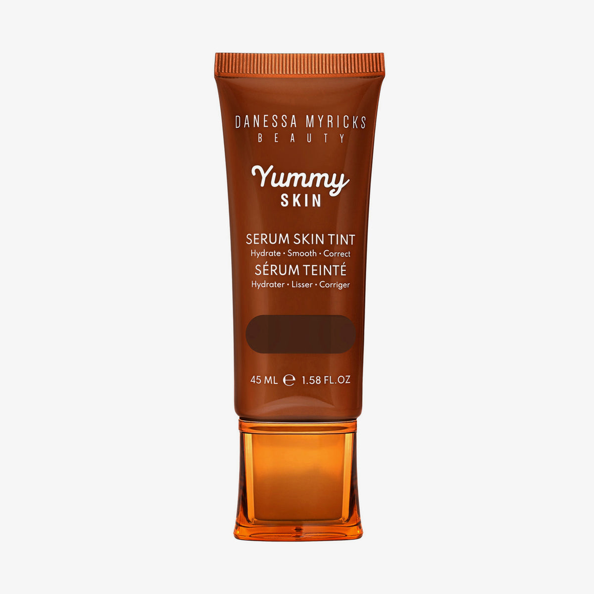 Bronzefarbene Tube der Yummy Skin Serum Tint 15 mit Sichtfenster zum tiefbraunem Produktinhalt.