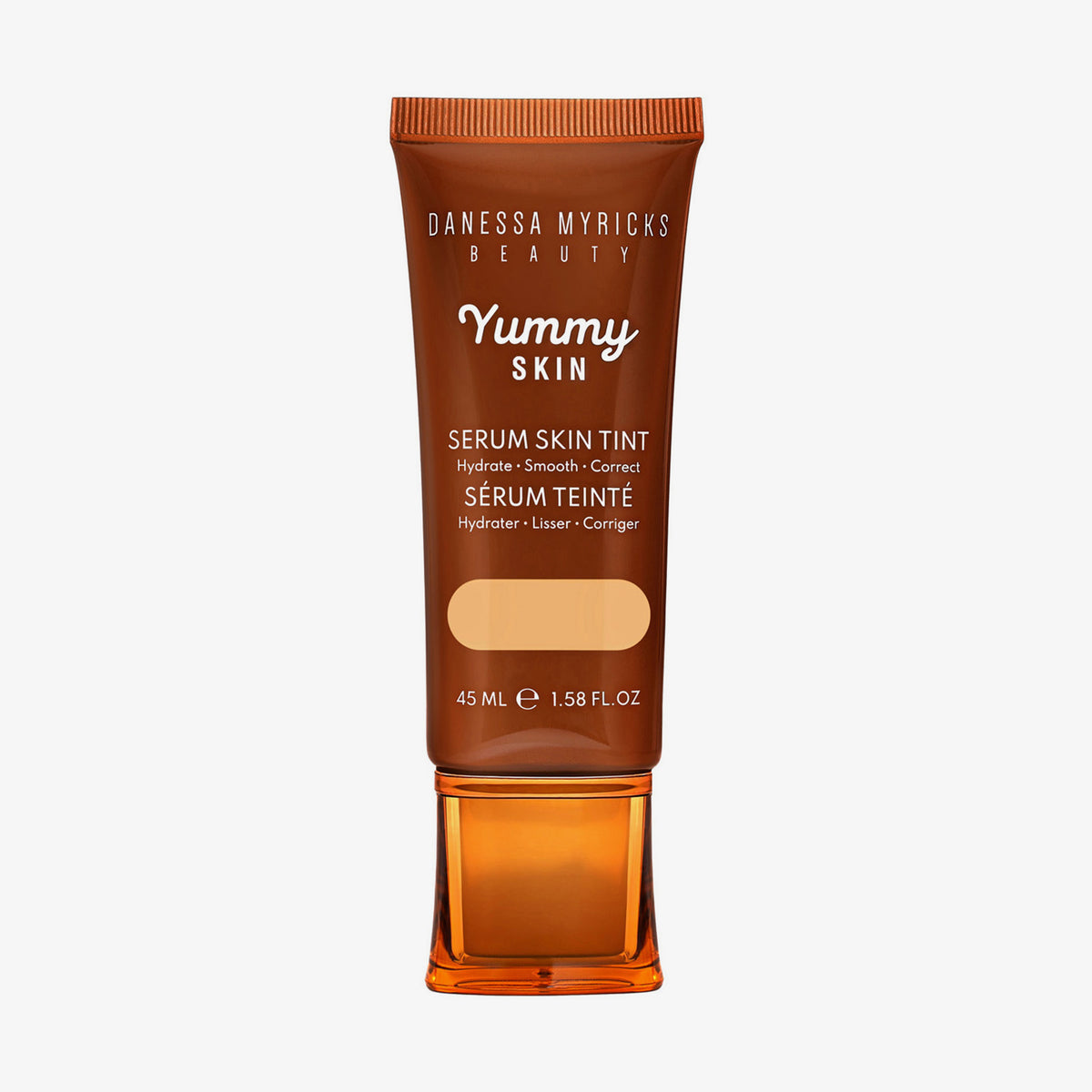 Bronzefarbene Tube der Yummy Skin Serum Tint 3 mit Sichtfenster zum mittelbeigen Produktinhalt.