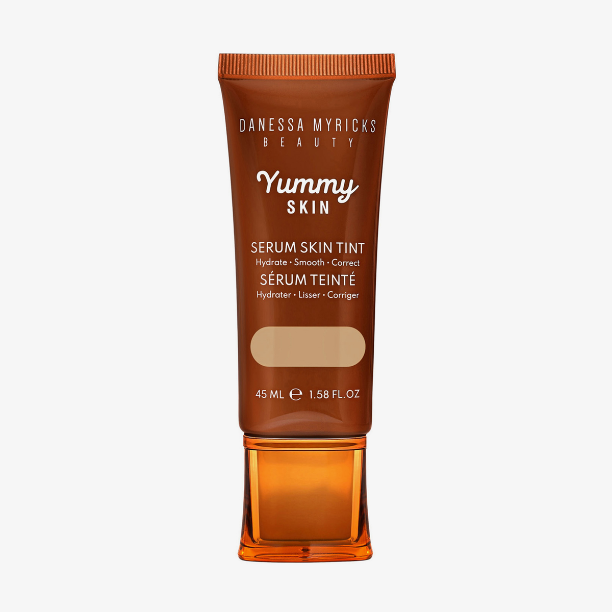 Bronzefarbene Tube der Yummy Skin Serum Tint 4.5 mit Sichtfenster zum dunkelbeigem Produktinhalt.