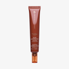 Eine braune 50-ml-Tube des Danessa Myricks Beauty Yummy Skin 10/10 Barrier Boost Serums mit orangefarbenem Verschluss.