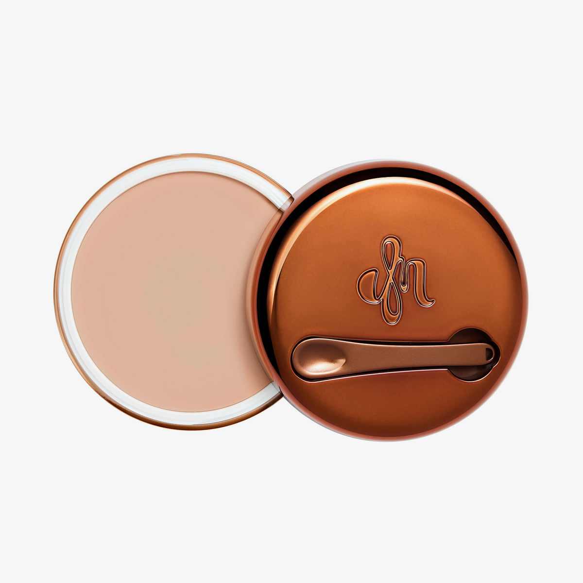 Runder geöffneter Behälter Yummy Skin Blurring Balm Shade 1.5 mit bronzefarbenem Deckel und kleinem Applikator.