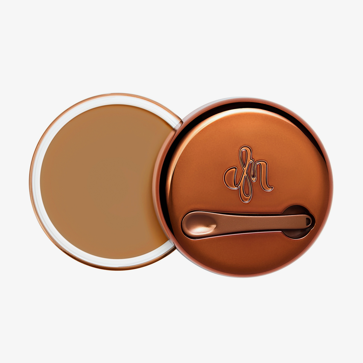 Runder geöffneter Behälter Yummy Skin Blurring Balm Shade 5 mit bronzefarbenem Deckel und kleinem Applikator.