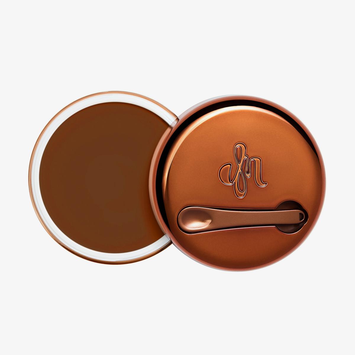 Runder geöffneter Behälter Yummy Skin Blurring Balm Shade 9 mit bronzefarbenem Deckel und kleinem Applikator.