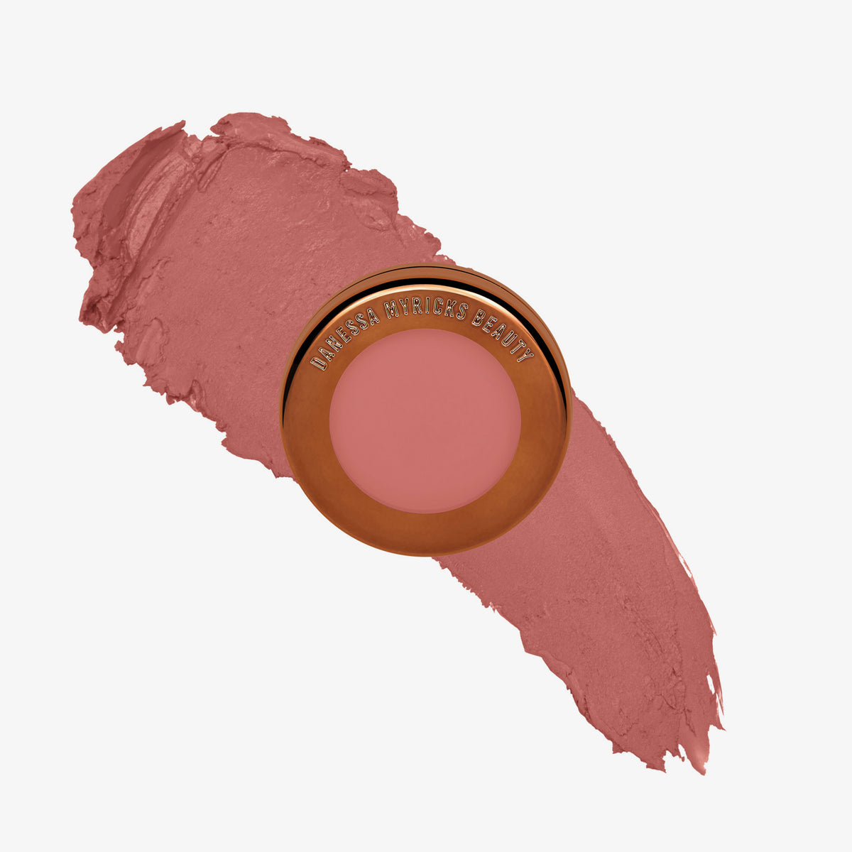 Yummy Skin Blurring Balm Powder Flushed Rose n Brunch in rundem bronzenem Behälter auf altroséfarbenem Farbmuster abgebildet.