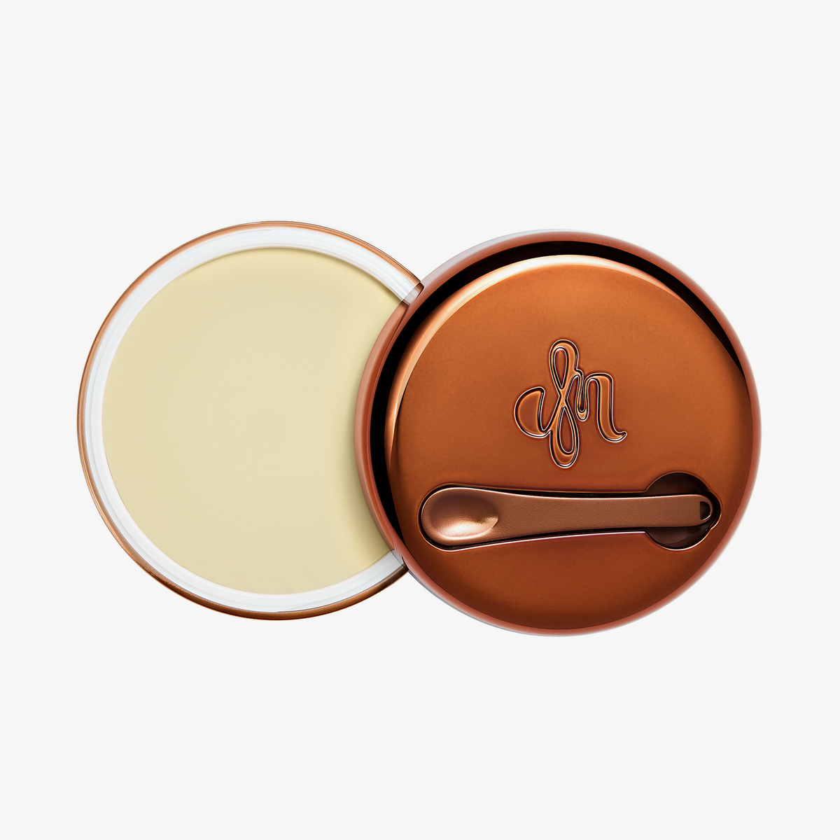 Runder geöffneter Behälter Yummy Skin Blurring Balm Shade Universal mit bronzefarbenem Deckel und kleinem Applikator.