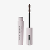 Geöffnete Tube der Lash Lift Tubing Mascara von Dominique Cosmetics mit Zauberstab-Applikator vor weißem Hintergrund.