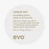 Weißer runder Behälter des Casual Act Moulding Whip von Evo mit humorvollem Produkttext auf dem Deckel.