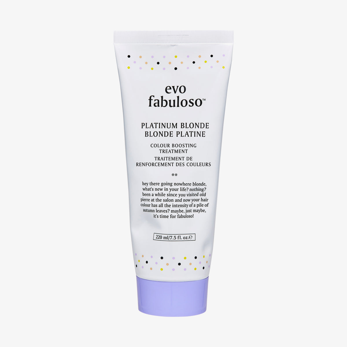 Weiße Tube Fabuloso Platinum Blonde Color Treatment mit schwarzem Text, buntem Pünktchen und violettem Deckel.