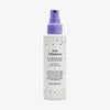 Weiße Pumpflasche Fabuloso Platinum Blonde Toning Mist mit violetter Sprühkappe und bunten Pünktchen.