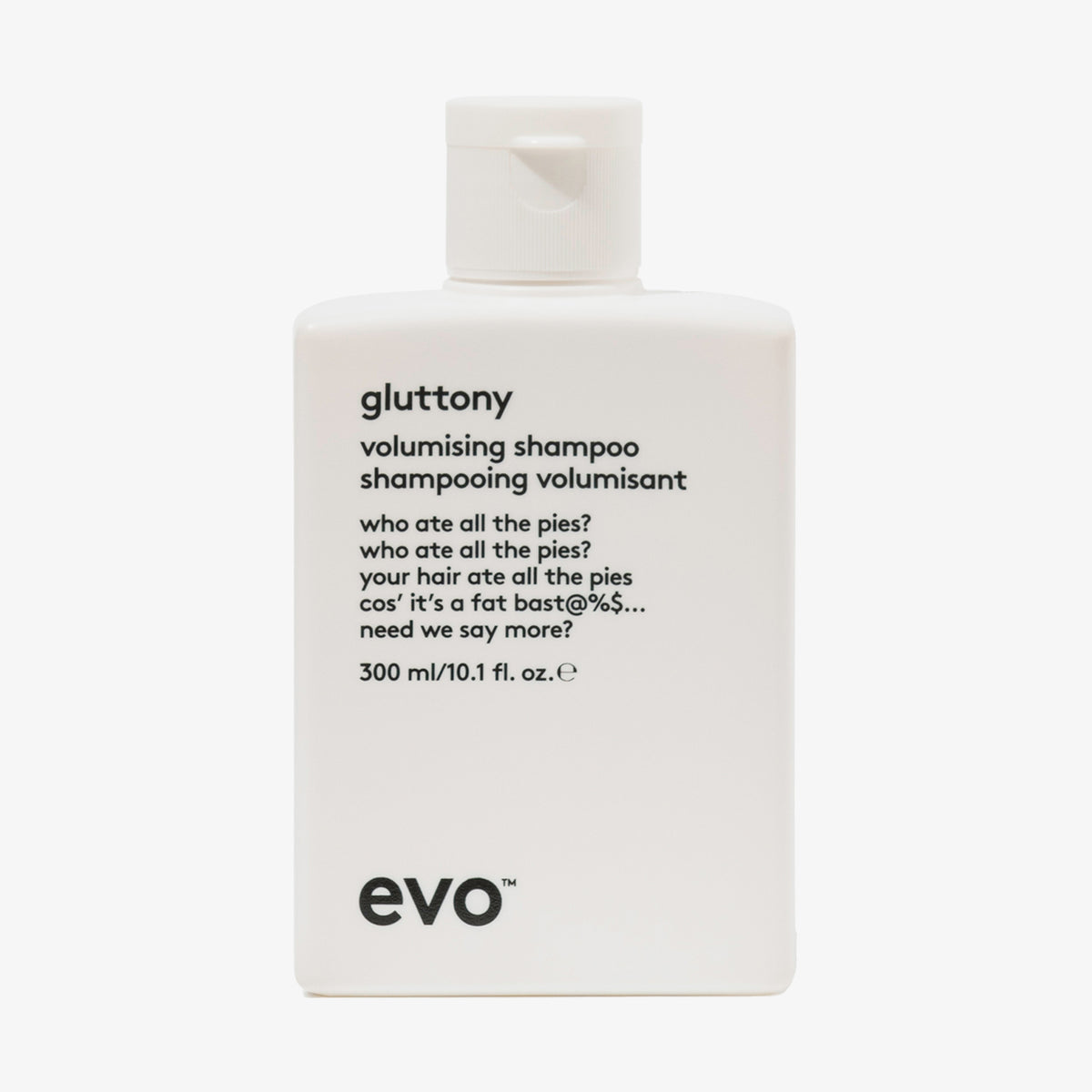 Weiße Flasche Gluttony Volume Shampoo mit humorvollem Produkttext vor weißem Hintergrund.