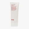 Weiße Tube Liquid Rollers Curl Balm mit humorvollem Produkttext vor weißem Hintergrund.