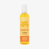 Eine Flasche Hair Syrup Vitamin C Me Pre-Wash Oil, 300ml, mit einem orangefarbenen Etikett und einem weißen Pumpverschluss.