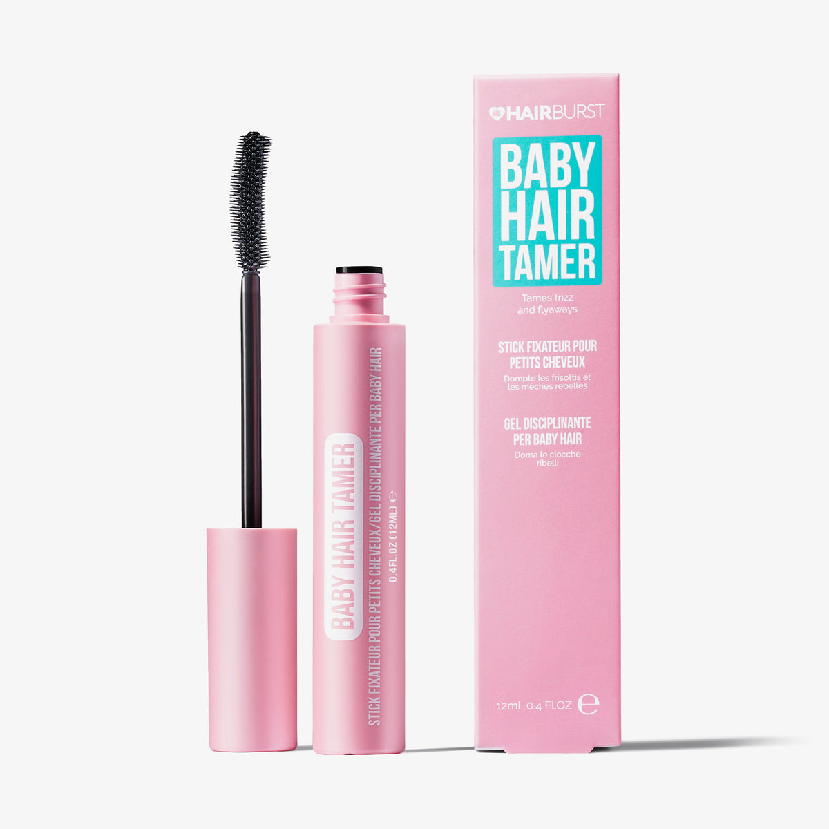 Rosafarbene Tube mit Bürstenapplikator und Schachtel Baby Hair Tamer von Hairburst vor grauem Hintergrund.