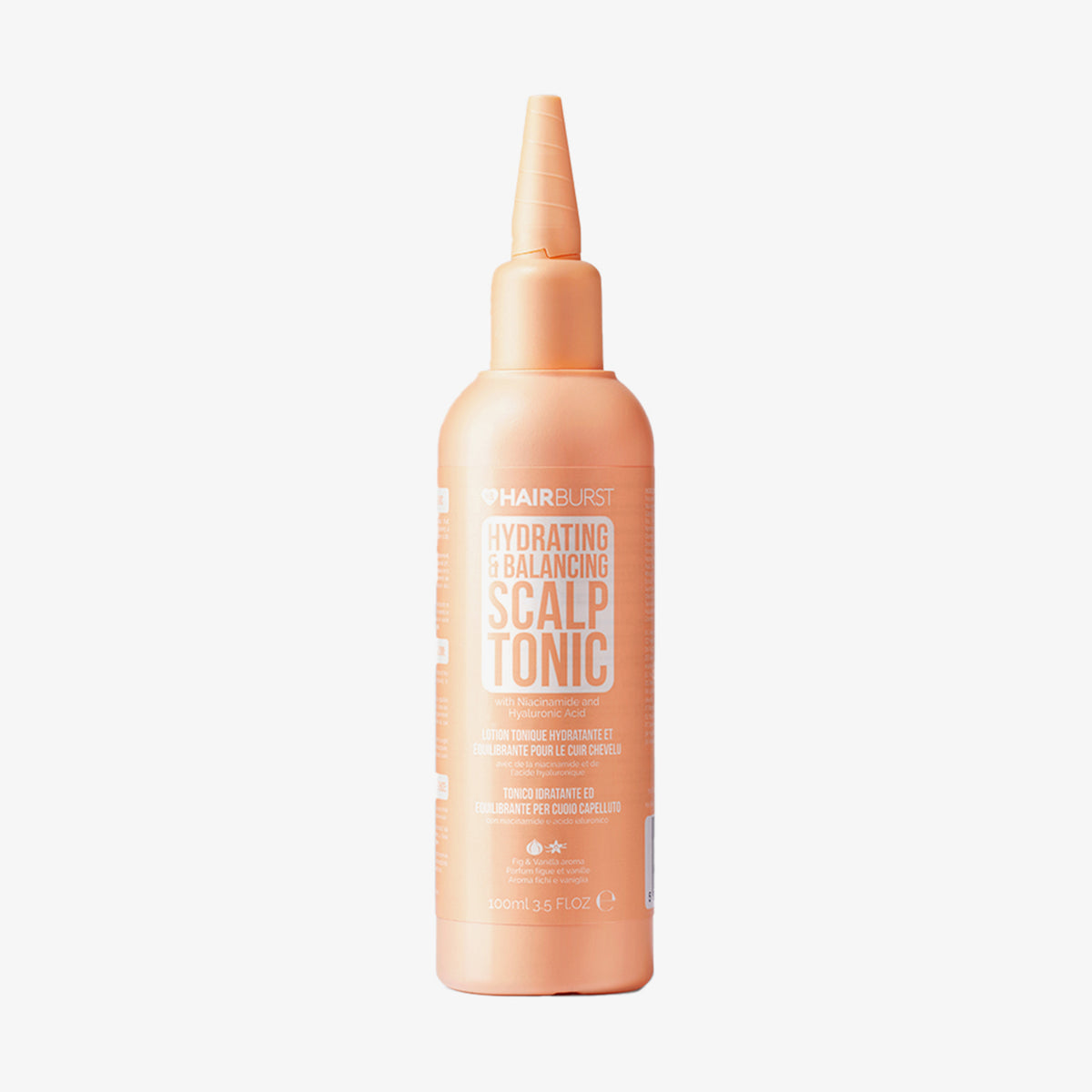 Pfirsichfarbene Flasche Hairburst Hydrating & Balancing Scalp Tonic mit spitzer Düse auf weißem Hintergrund.