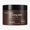 Brauner Tiegel Pore Cleansing Balm BHA mit schwarzem Deckel vor weißem Hintergrund.