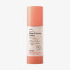 Hanskin Vitamin C Glow Capsule Lotion in einer pfirsichfarbenen und mattierten transparenten Flasche mit kleinen orangefarbene Kapseln.