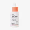 Weiße Tropfflasche Hanskin Vitamin C Glow Serum mit pfirsischfarbenen Akzenten vor weißem Hintergrund.