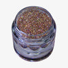 Offener transparenter Tiegel des Glitter Pot Mrs Rose mit gold-rosa schimmerndem Glitzer auf weißem Hintergrund.