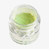 Offener transparenter Tiegel des Pastel Duochromes Loose Eyeshadow Pom Pom mit heller neongrün schimmernder Textur auf weißem Hintergrund.