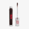 Auf weißem Hintergrund ist eine Tube Dexter Lip Oil Aconite von Lethal Cosmetics mit geöffnetem Applikator abgebildet.