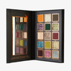 Die „Over The Garden Wall – Tome of the Unknown“-Palette von Lethal Cosmetics mit 16 farbenfrohen Farbtönen und einem rechteckigen Spiegel auf der linken Seite.