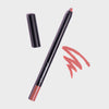 Offener Crayon Make-up-Stift in der Farbe Soft von LH Cosmetic neben einer rosanen Kritzelei auf weißem Hintergrund.